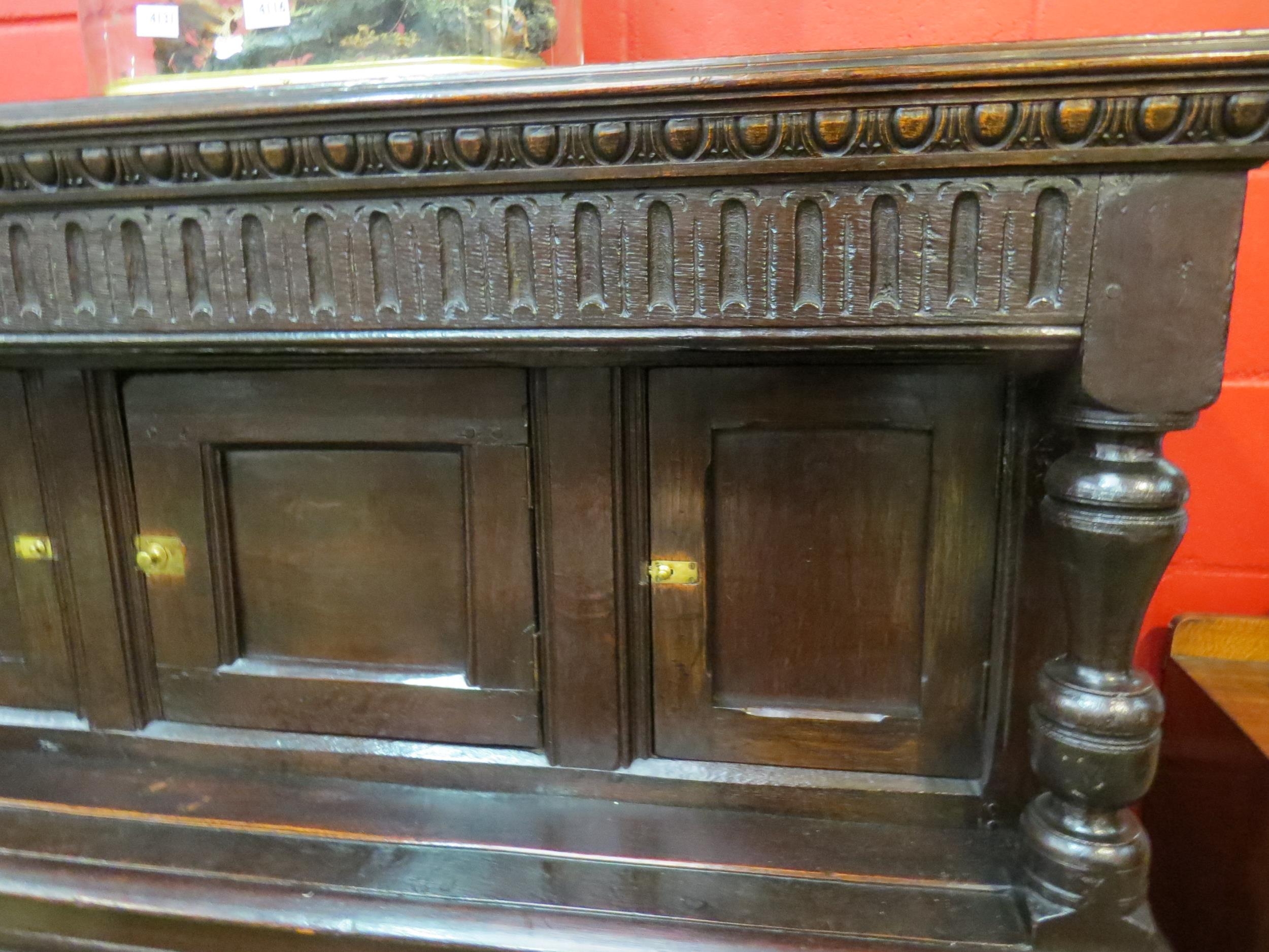 A Circa 1700 English pegged oak court cupboard with unusual bank of nine cupboard panelled doors - Image 4 of 8