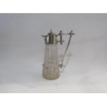 A Christopher dresser style claret jug, cut glass, silver plated mounts, 26cm high