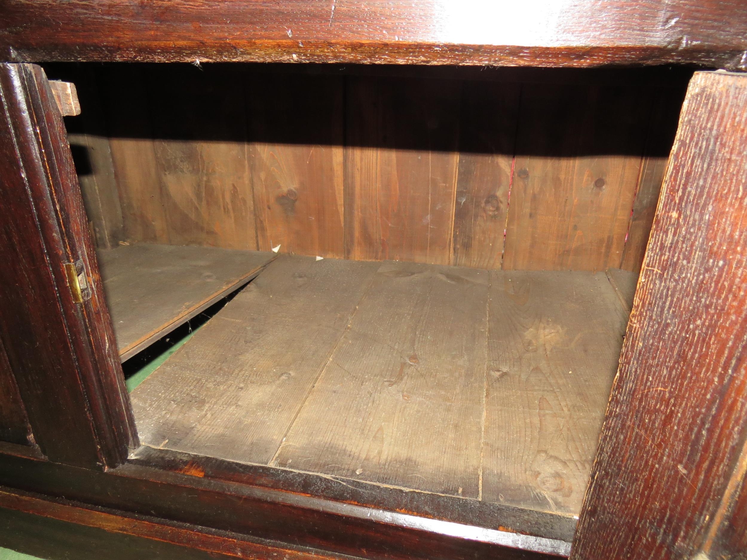 A Circa 1700 English pegged oak court cupboard with unusual bank of nine cupboard panelled doors - Image 8 of 8