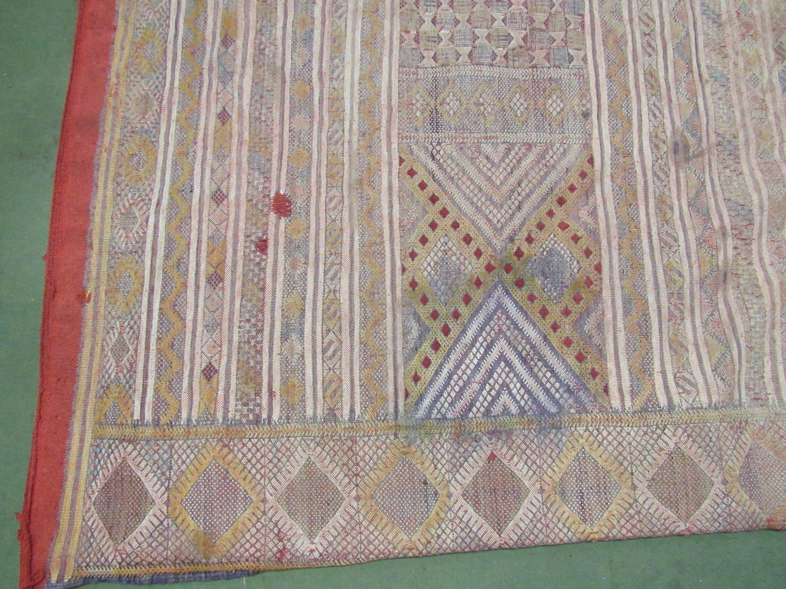 An Eastern hand woven geometric design rug, badly stained, a/f, 316cm x 178cm - Image 5 of 6
