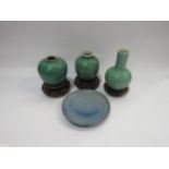 Four pieces of Oriental glazed ceramics including Celadon, some a/f, with three matched wooden