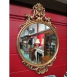 A gilt classical style wall mirror with scrolled foliate design, 107cm x 70cm total
