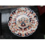 A Victorian Imari charger with scalloped edge, a/f cracked 38cm diameter.