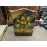 A miniature table cabinet with lacquer finish and painted doors depicting a lemon tree, two doors