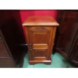 A late Victorian walnut panelled single door bedside cabinet on a plinth base, 78cm high x 40cm wide