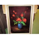 A gilt framed acrylic on velvet of red flowers with green leaves in a blue bowl, signed lower