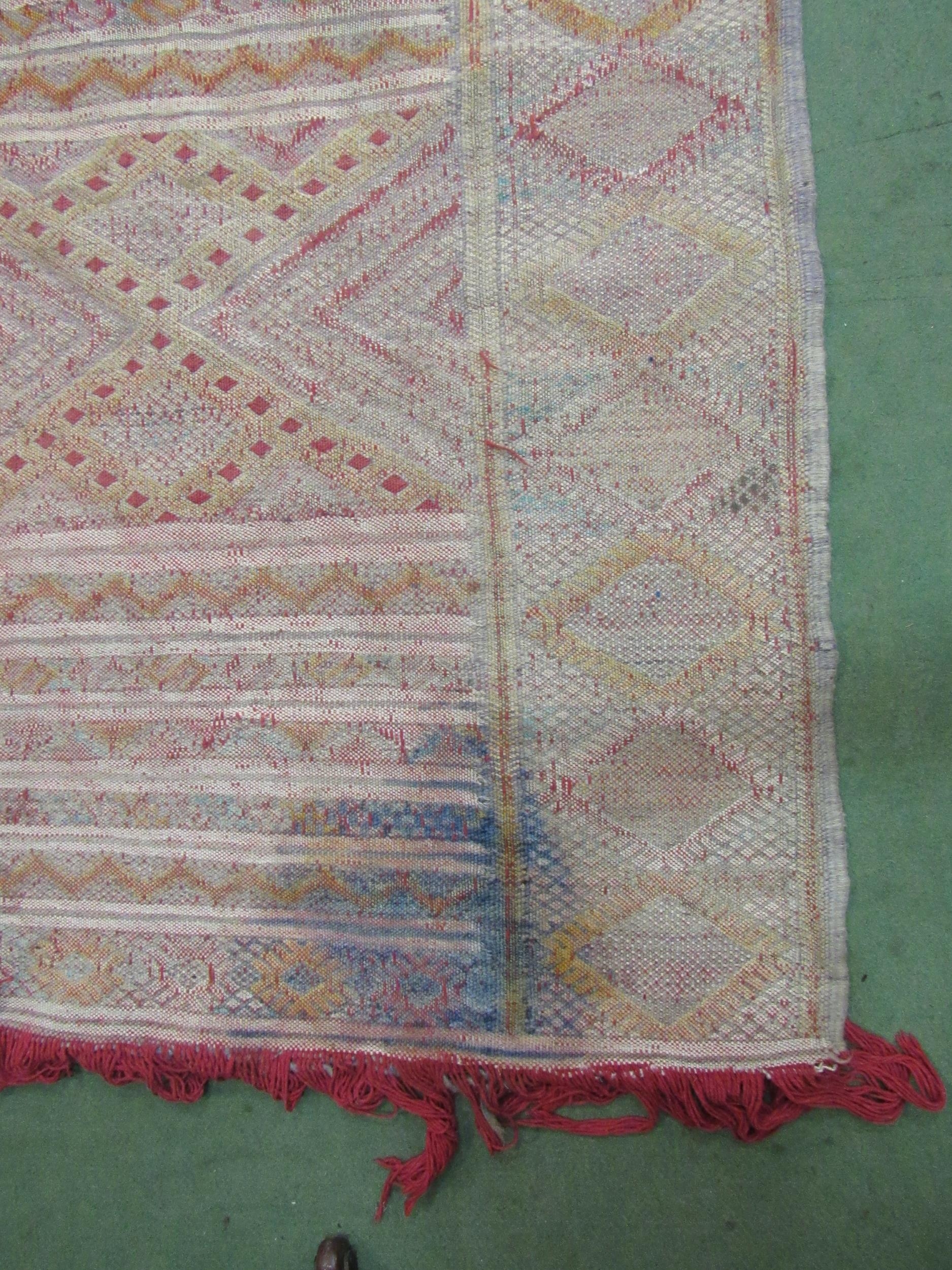 An Eastern hand woven geometric design rug, badly stained, a/f, 316cm x 178cm - Image 3 of 6
