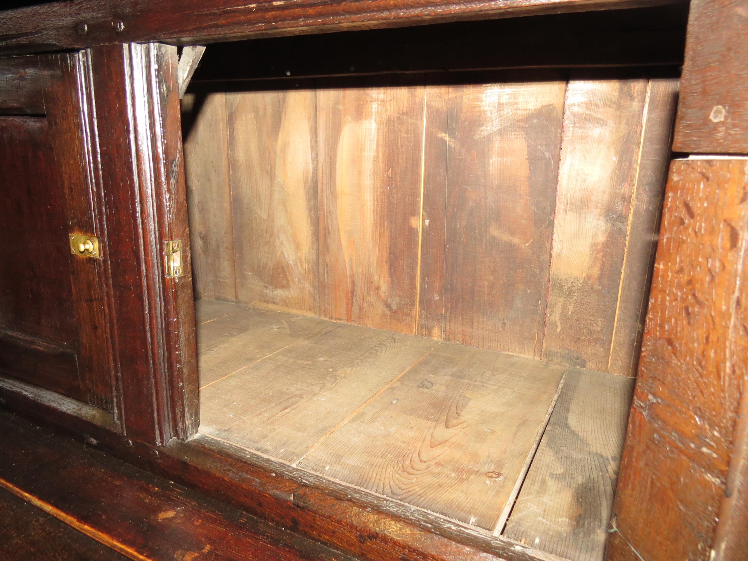 A Circa 1700 English pegged oak court cupboard with unusual bank of nine cupboard panelled doors - Image 6 of 8