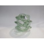 A handmade recycled glass decorative swirl