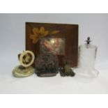 A pair of cast metal bookends, a glass watch dome, a watch holder, ships wheel nutcracker and