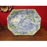 An Oriental blue and white meat platter with green tint, decorated with vase of flowers and birds in