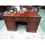 A 19th Century mahogany twin pedestal desk, the three frieze drawers over two single door
