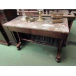A mid Victorian mahogany and marble top library table the two frieze drawers on a tapered base