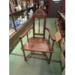A pair of 19th Century French walnut open armchairs with carved backrest, turned spindles on