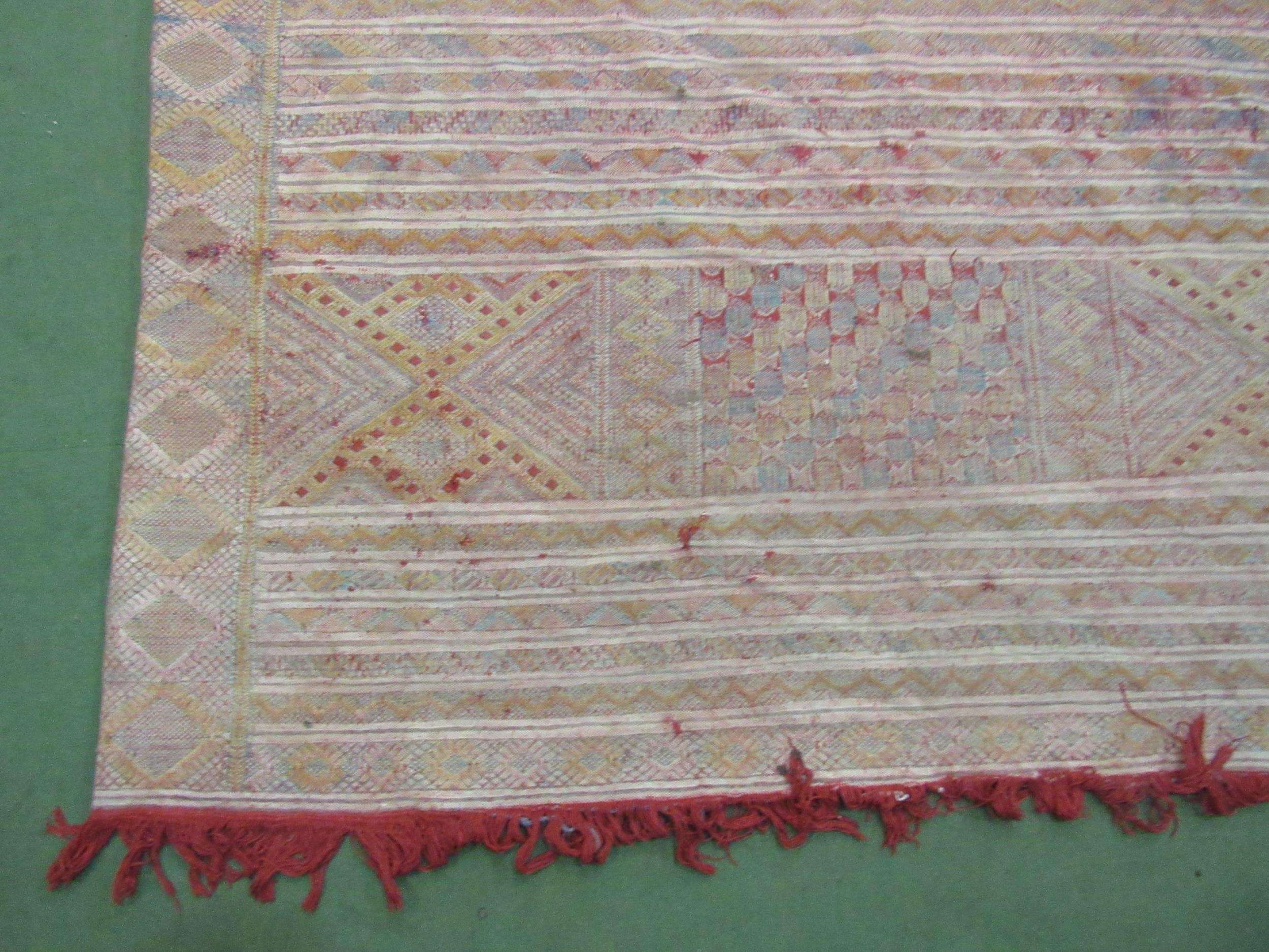 An Eastern hand woven geometric design rug, badly stained, a/f, 316cm x 178cm - Image 4 of 6