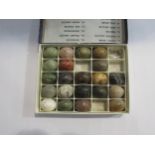 A box of various stone eggs, (22)