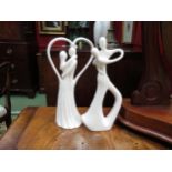 Two white porcelain circle of love style figurines, 26cm tall
