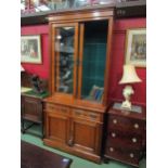 A late Victorian satin walnut chemist/doctor's cabinet on base the two glazed sliding doors with