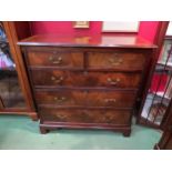 A Georgian revival inlaid and crossbanded flame mahogany chest of two short over three graduating