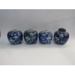 Four Chinese blue and white ginger jars, one with lid, 13cm tall, decorated with Cherry Blossom