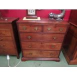 A 19th Century flame mahogany caddy top chest of two short over three graduating long drawers on