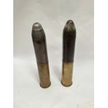A WWI German shrapnel shell and HE shell, both with brass shell cases