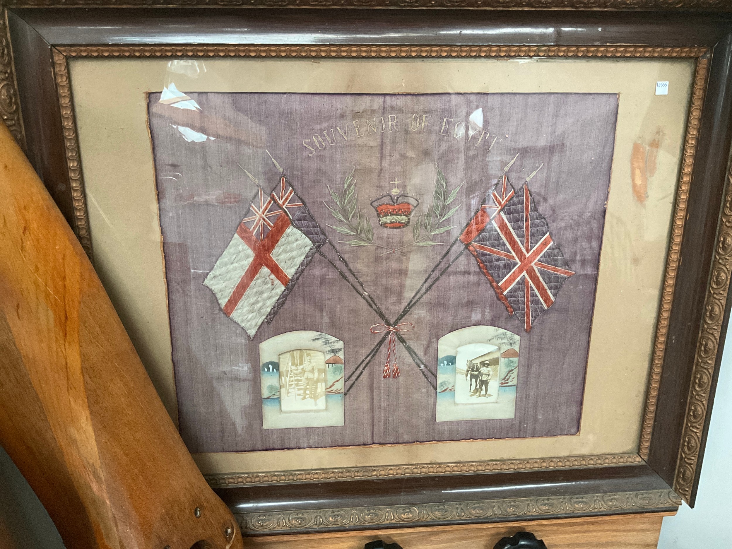 A 'Souvenir of Egypt' embroidered silk panel with crossed flags and crown design, with inset