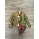 An early 20th Century Scottish child's velvet dress jacket with tartan sash, thistle design brass