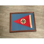 A reproduction Nazi pennant, framed and glazed.