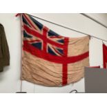 A WWI era Royal Naval ensign flag, thought to be from a battleship, some damage.