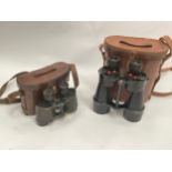 A pair of WWII British Army binoculars with brown leather case, together with another pair of