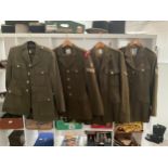 Four post war British No. 2 service dress jackets with trousers, one with Grenadier Guards