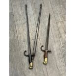 A French Gras fire poker and a pair of tongs (2)