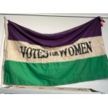 A reproduction Votes for Women Suffragettes flag
