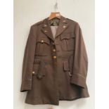 A WWII US 8th Air Force officer's uniform jacket, trouser and hat with original insignia