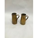 A pair of trench art brass shell case jugs
