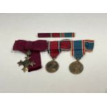 A George VI MBE medal in silver together with George V 25 year Jubilee medal and George VI