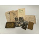 A WWI 1914 Princess Mary gift tin with various documents, booklets and a 1918 soldier's bible