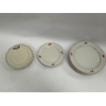 A set of six 1940's dinner plates and three matching side plates bearing flags of USA, France,