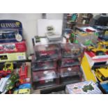 Seven perspex cased Atlas Editions Classic Fire Engines and five boxed Trams Of The World, with