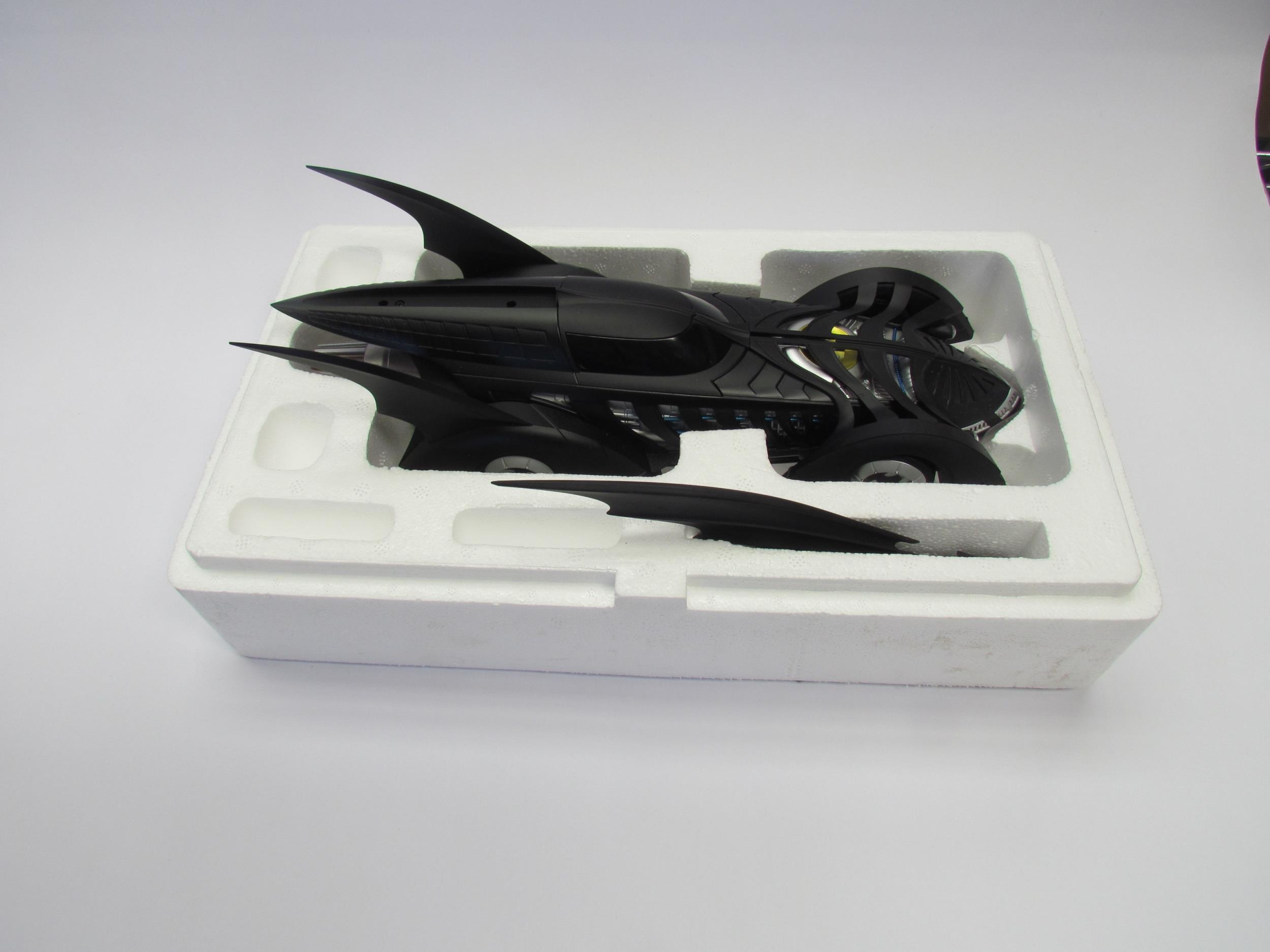 A boxed Hot Wheels 1:18 scale Batman Forever Batmobile