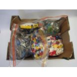 A collection of loose Lego including locomotive, figures, Technic motorbike, boat, blocks, base