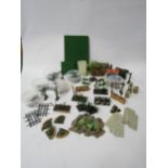 A collection of Britains Floral Garden range items to include two wheelbarrows, lawn mower,