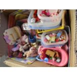 A collection of Sylvanian Families figures and accessories