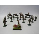 A collection of lead figures of WW1 era British Army servicemen including mounted officers and
