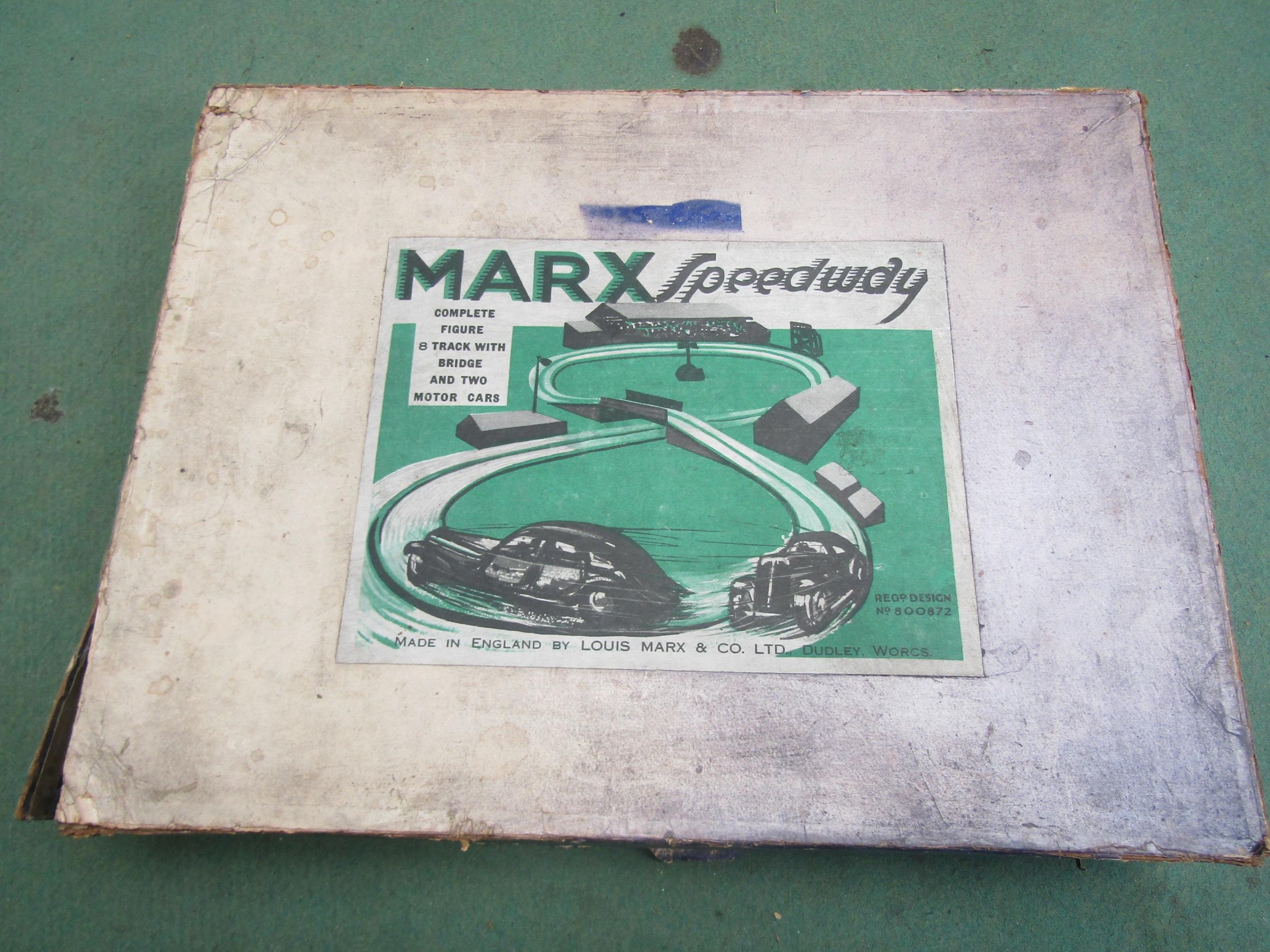 A Louis Marx & Co Ltd. Marx Speedway tinplate clockwork racing set, box faded