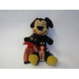 A Walt Disney Mickey Mouse soft filled toy and two gollies (3)