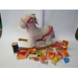A soft filled rocking horse and a collection of Pintoy wooden dolls house furniture