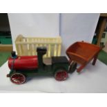 A painted wooden model train wheelbarrow and crib (3)