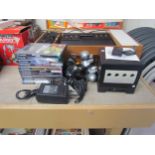 A Nintendo GameCube computer games console with Game Boy Player, Startup disc, two controllers,